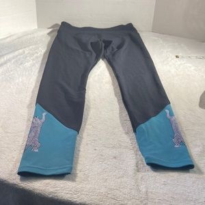 L.A.M. Woman’s Black and Green Stretch Pants With Climbing Leopards